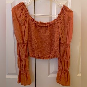 orange off the shoulder smocked top